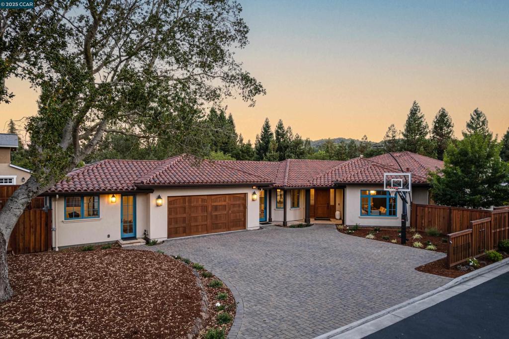 Built in 2017, this 5-bedr, 4.5-bath Mediterranean-style home blends timeless architecture with every modern comfort. Elegant hardwood floors, soaring ceilings, marble and quartz surfaces, and designer tile and fixtures set a refined tone from the moment you walk in. At the heart of the home, the expansive kitchen and great room offer a warm, open space perfect for daily living and easy entertaining. The kitchen is a chef’s dream, with a marble island, high-end finishes, 2 walk-in pantries, and a separate butler’s pantry for seamless hosting. The primary suite has private patio access, a spa-inspired bath with dual sinks, soaking tub, spacious shower, and large walk-in closet. 3 additional bdrms include a Jack-and-Jill bath and a private ensuite. A stylish powder room serves guests, and the 5th bedroom—fitted with custom built-ins—makes an ideal home office. The separate au pair suite—connected to the garage—includes a full bath, built-in Murphy bed, and its own mini-split system for independent comfort and privacy. Outside, the oversized yard and patio are made for entertaining. Raised garden beds, fruit trees, a play structure, and storage shed add both beauty and function. Set on a peaceful private street, this home is just minutes from top-rated schools, the town center.