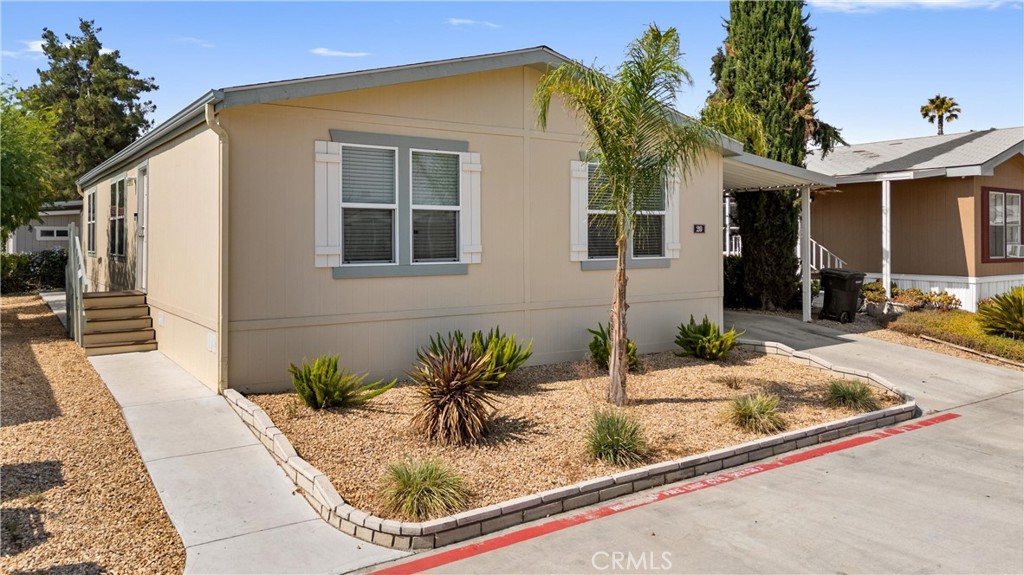 Welcome to Your Dream Home in the Gated Parkview Estate Community! Step into this beautifully maintained 3-bedroom, 2-bath home featuring an open-concept layout with stylish laminate flooring and neutral tones throughout—ready for your personal touch. The spacious kitchen boasts stainless steel appliances, a center island, and a seamless flow into the family and dining areas, perfect for entertaining or relaxing with loved ones. Retreat to the primary suite with a walk-in shower and generous walk-in closet for added convenience. Outside, you’ll find storage shed and a covered 2-car carport for extra space and functionality. Step into resort-style living with an impressive array of amenities designed for comfort, wellness, and fun. Enjoy sunny days by the in-ground pool or unwind in the spa/hot tub and sauna for ultimate relaxation. Stay active with a fully equipped fitness center, challenge friends in the game room, or shoot hoops at the basketball court. Families will love the playground and open green spaces, while pet owners will appreciate the dedicated dog park. Planning a celebration? Host unforgettable gatherings in the community hall, perfect for banquets, parties, and events. For added convenience, the community also offers a secure RV storage area—everything you need, all in one place. Don't miss your chance to own a home that blends style, comfort, and community- Schedule your private showing Today!