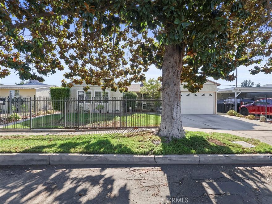 Open House: Sun 10/12, 2–5 PM. Welcoming single-story gated home with major upgrades, offering 3 bedrooms and 1 bathroom, a formal living room, spacious family room, open-concept kitchen with breakfast nook, enclosed patio, and a large private backyard with an above-ground pool. Includes a two-car garage and wide driveway for extra parking. With a freshly painted interior, this home also features a roof about 10 years old, a 200-amp electrical panel, dual-pane windows with plantation shutters, mostly copper plumbing, and purchased solar with roughly 10 years remaining. Excellent location in a quiet, rapidly transforming pocket just off Woodman Ave on a tree-lined street. Close to Vallarta, CVS, Kaiser, and minutes to the 405, 170 & 5 freeways. Step inside to a bright living room with tile floors. The spacious family room with wood paneling and tile floors offers the perfect setting for relaxing or entertaining. The open kitchen provides abundant cabinet and counter space, with a breakfast nook and direct access to the covered patio. The dining room features a classic chandelier and a large window overlooking the front yard. Bedrooms include ceiling fans and ample closets, while the full bath offers a vanity, tile accents, and tub/shower combo. Adjacent to the kitchen, an enclosed covered patio provides versatile space with a laundry area and extra room for storage or hobbies. From here, step out to the outdoor patio with a built-in sink and counter space, perfect for barbecues and entertaining. The patio opens to an extremely private backyard featuring a midsize above-ground pool surrounded by mature trees, multiple sitting areas, and a large storage shed, creating a low-maintenance retreat that’s both functional and refreshing for relaxing or gathering with family and friends. Ask about the ADU potential with the existing garage and permitted family room addition. This home shows pride of ownership throughout and offers great curb appeal with a gated front yard. If you're looking for a private, move-in ready home on a desirable tree-lined street in a central location near shopping, dining, and major freeways, this is it!