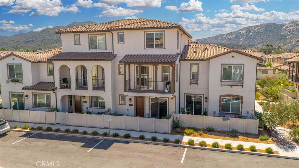 Welcome to Via Nubes, where modern meets smart living in this beautifully maintained 2 bedroom, 2.5 bath condo with a versatile flex space in South Temecula. Featuring fully paid solar, a two-car garage and all appliances included, this home feels larger than many 3 bedrooms thanks to its open-concept the main second level features quartz kitchen counter with designer backsplash, light filled living and dining areas with direct access to a private balcony. The first floor flex room with its own patio is ideal as an office, gym or guest retreat, while the third floor offers two spacious primary bedrooms with en-suites one with two walk-in closets and second with spacious closet. Located in the sought after gated Rancho Soleo community, residents enjoy resort-style amenities including a pool, spa, clubhouse with outdoor kitchen and BBQs, playgrounds, walking paths and a dog park all within minutes of Great Oak High School, Pechanga, Old Town Temecula and Wine Country. With thoughtful upgrades and a prime location, this home is the perfect blend of comfort, style and convenience.