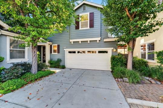 Welcome to 7902 Kipling Circle in the desirable Oak Commons community of sunny Gilroy. This beautifully maintained 3-bedroom, 2.5-bath single-family home offers over 1,600 sq. ft. of living space on a 2,700+ sq. ft. lot. Built in 2005 and updated to feel like new, it features a modern open-concept layout with a gas-starter fireplace, stainless steel appliances, and abundant natural light. Enjoy the rare convenience of a side-by-side two-car garage plus two additional parking spaces. The backyard is a private retreat with a peach tree, two lime trees, a grapefruit tree, and a wood deck perfect for relaxing or entertaining. Solar panels add energy efficiency, while central air conditioning keeps you comfortable year-round. The Oak Commons community offers landscaped walking paths, a swimming pool, and a park. Conveniently located near the west side of Gilroy, with easy access to shopping, dining, Highway 101, and scenic Mount Madonna. A perfect blend of comfort, convenience, and community.