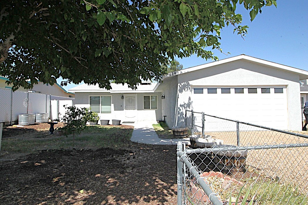 This home has all the charm it needs for the first time buyer. The home has mini split-AC units in the living room and bedroom. This is sure to keep you nice and cool in the hot summer months. There is a 2-car garage attached. The flooring is a nice durable tweed carpet. The kitchen, and bathrooms is ceramic tile. The kitchen is all remodeled with a beautiful window overlooking the shaded backyard. This home reeks of pride of ownership and priced to sell!!
