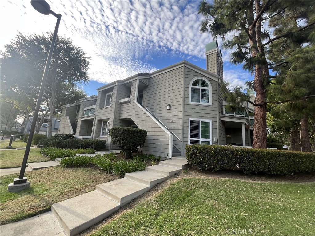 Deluxe Beach Lifestyle in exclusive, safe and unique property! Perfectly located top floor corner unit with private entry staircase, 2 large balconies and high ceilings in a recently remodeled 2 bedroom, 2 full bath, guard-gated luxury condo. Premium kitchen appliances with refrigerator, plus, an in-home Washer/Dryer, Central A/C and working fireplace to keep cozy in the winter! Steps away from HB High School, local grocery, shopping and restaurants and less than an 8 minute bike ride to the Ocean. Located within a peaceful, established and beautifully landscaped private community, this also includes a private 1 car garage and additional parking spot. Quiet living with soundproofed walls. Amenities include 3 community pools. Master suite has his and hers sinks, a walk-in closet, plus additional attic storage.