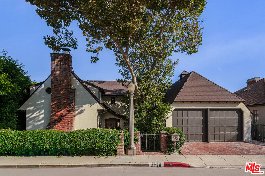 A place where history and imagination meet. Built in 1928, this English Tudor home is not simply a residence it is a stage for life's most meaningful moments, designed with artistry that endures. Step through the grand doorway and enter a world of character and charm. Leaded glass windows scatter light across coved ceilings, original hardware, and a magical staircase that feels both noble and inviting. A stately decorative fireplace anchors the living room. Every detail is a reminder of heritage not replicated, but preserved. Upstairs, three bedrooms and two baths create a private retreat. Downstairs, a fourth bedroom and expansive family room offer versatility, a creative studio, a guest suite, or simply a place to relax. From here, doors open to an outdoor world that feels rare in Los Feliz: a wide grassy lawn, a shaded, covered patio for meals under the stars, a sparkling pool, and mature trees that frame the views with a sense of wonder and calm. This is a property that offers both intimacy and grandeur. Moments to Vermont or Hillhurst for cafes and culture. Wander into Griffith Park for hiking, tennis, or nights at the Greek Theatre. 3756 Effingham Place is not just where you live. It's where history, elegance, and imagination converge. A place to write your own chapter. The property has been virtually staged. Neither the seller nor listing broker make any representations regarding the virtually staged images, and if they accurately reflect the design and condition of the property.