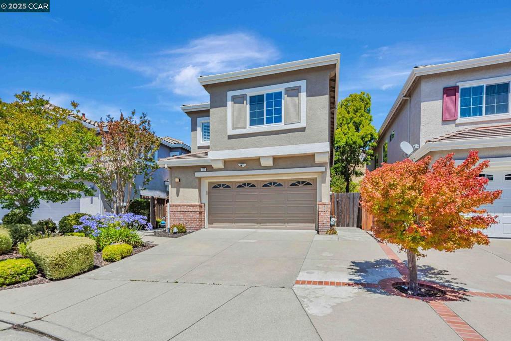 Welcome to this beautifully updated 4-bed, 2.5-bath home situated on one of the larger 5,300 sqft lots in a quiet cul-de-sac. No rear neighbors and no HOA! Located in the top-rated San Ramon Valley Unified School District. The open-concept layout features soaring ceilings, new hardwood wide-plank floors, plantation shutters, built-in speakers, and smart home amenities. Enjoy ultimate flexibility with both a family room and living room, plus a separate formal dining room, perfect for entertaining indoors and out. At the heart of the home, the modern kitchen boasts stainless steel appliances, solid-surface counters, ample storage, and an oversized island for gathering with family and friends. The kitchen flows into the family room with year-round views of lush green hills. Upstairs, a large bonus loft offers versatile space for a TV room, play area, or home office. The primary suite includes a spacious walk-in closet. Recent updates include new floors, smart fridge, washer and dryer, new AC, and fresh interior paint, making this home move-in ready. Enjoy a private, low-maintenance backyard ideal for relaxing and entertaining. Conveniently located near top-rated Twin Creeks Elementary, Iron Horse Middle, and California High, plus parks, trails, shopping, dining, hwy680. Come see!
