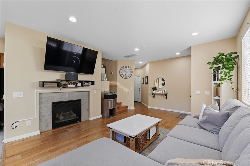 Modern Comfort in a Gated Community in West Murrieta! Welcome to this beautifully updated 2-bedroom, 2 and 1/2 bath condo located in a secure gated community with great amenities including a sparkling pool, relaxing spa, and park areas. Step into the bright, open living room featuring a cozy fireplace, perfect for relaxing nights in. The kitchen boasts beautiful countertops, stainless steel appliances, and a walk-in pantry. This home offers ample rooms with modern finishes, an attached garage for convenience, and a private backyard adorned with string lights, an ideal space for entertaining or unwinding under the stars. Stylish, spacious, and move-in ready this home truly has it all! Walking distance to Old town Murrieta, library, shopping and award winning schools! Don't miss your chance to see it!