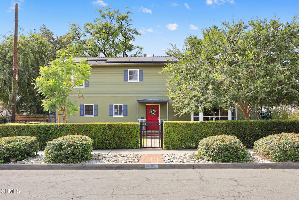 Welcome to this beautifully updated 1947 Colonial-style residence in Pasadena's charming Daisy Villa neighborhood. With 3 bedrooms, 3 baths & 2,433 square feet (taped), this move-in ready home blends endearing character with desirous upgrades. Set on a lush 9,398 square foot lot, the house greets you with a central brick walkway leading the eye to a welcoming front door surrounded by shade trees and well-kept landscaping. Step inside, and feel the warmth from architectural details, soothing color palate and hardwood floors creating a classic and elegant home. To the right of the entry, the formal living room features a lovely fireplace and a large bay window for soft morning light and views. The formal dining room keeps with tradition showcasing built-in corner cabinets and decorative moldings - think holiday dinners!An adjacent family room is spacious, comfy and built for movie nights - complete with surround sound system. French doors open out to a large deck with pergola ideal for dining amidst a lovely backyard. The wonderful kitchen, completely remodeled in 2022, was designed by - and for - a true cook! Featuring the LG line of stainless appliances - including a six-burner range, a Kraus 'work-station' sink, custom cabinetry with Rev-A-Shelf designs and lots of pantry space - Be sure to see the built-in coffee station and microwave cabinet. The laundry room conveniently connects to the kitchen and driveway or added efficiency. Upstairs, you'll find 3 comfortable bedrooms, including a spacious primary suite with its own dressing area, closet space and an attached deck for stunning views of the San Gabriel Mountains. The other 2 bedrooms are roomy and share a Jack & Jill bath with vintage touches. Storage is a breeze with floor-to-ceiling closets along the upstairs hallway. The lush backyard is picturesque and tranquil - There are 3 fountains, mature trees, garden beds and 7 different fruit trees! Some additional features include a bolted foundation, newer roof (2021), finished 3-car garage, Tesla solar panels (paid off), Powerwall & Universal car charger, plus smart home technology lighting and irrigation systems as well as enjoyable whole house & deck music speakers. Just a stone's throw to Pasadena's popular Saturday morning Farmer's Market, three parks, Alice's dog park, golf and many shopping and restaurant options. This exceptional home has so much to offer - Come see for yourself what makes this property truly special.