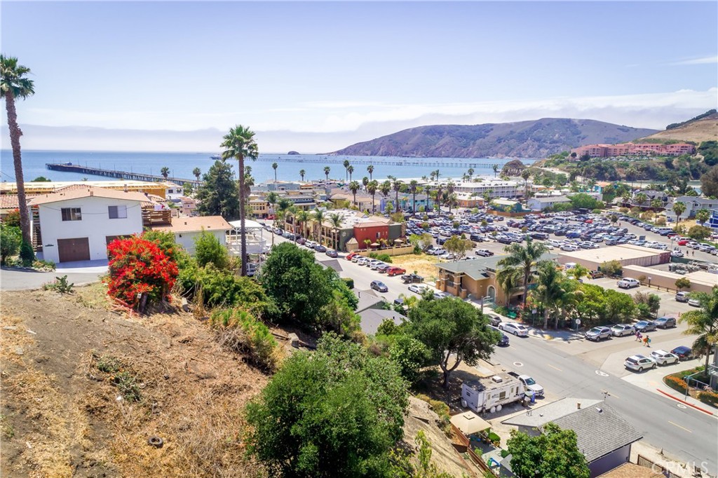 Ocean Views in Avila! Looking for that forever view? Look no further! This amazing Avila Beach ocean view parcel is perched high overlooking Avila Bay at the end of 2nd St. This southwest facing location offers panoramic views with excellent exposure into this timeless beach town, the Avila golf course, and of course the blue ocean from the pier to the point. This hillside lot allows you to design a home into the topography taking advantage of the view potential from every floor without the worry over view blockage. Truly a unique opportunity as this is the only hillside lot left on this stretch of downtown Avila Beach! The property has been surveyed and boundaries have been marked. Property is zoned Residential Multifamily. Seller financing available to well qualified buyers!