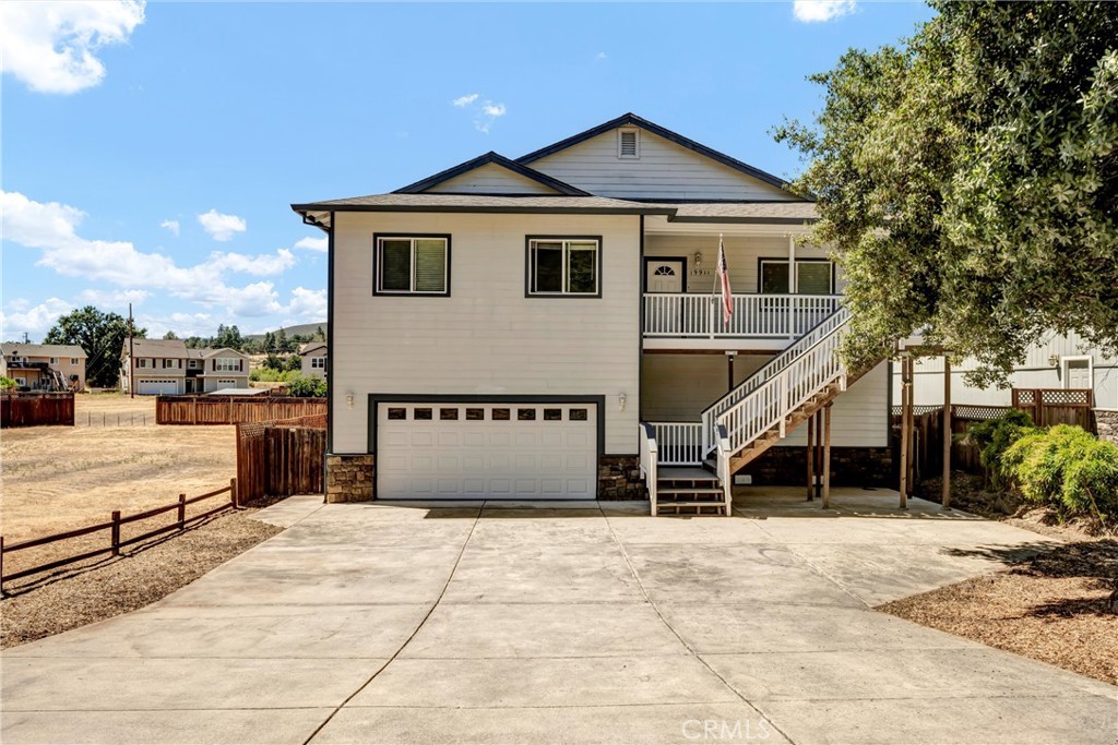 Turn-key and stylish, this 4 bedroom, 3 bathroom home in the gated community of Hidden Valley Lake offers 2,376 square feet of beautifully refreshed living space. Recently updated with newer interior paint, plush carpet, stainless steel appliances, and a newer back deck and stairs, this home feels fresh, modern, and move-in ready. As you enter, you’re welcomed into a spacious front family room with soaring vaulted ceilings—a perfect bonus space for a game room, home office, or second living area.
The open-concept kitchen and living room serve as the heart of the home, featuring a large center island, ample cabinet storage, and seamless access to the back deck—ideal for entertaining or relaxing outdoors. The kitchen boasts sleek stainless steel appliances and flows easily into the main living area, creating a warm and functional gathering space.
The generously sized primary suite offers a private retreat with direct access to the back deck, a walk-in closet, and an en-suite bathroom complete with dual vanities, a soaking tub, and a separate walk-in shower. Three additional bedrooms provide flexibility for family, guests, or creative spaces, with two additional full bathrooms thoughtfully positioned throughout the home.
Below the home, the expansive garage offers plenty of space for vehicles, storage, or a workshop setup—ideal for hobbyists or those in need of extra space. The fully fenced backyard features dual gated access on each side of the house, perfect for pets, play, or simply enjoying your outdoor space in privacy.
Located north of Napa Valley and approximately one hour to Santa Rosa, Hidden Valley Lake offers a wealth of amenities including a private lake with two beaches, a community pool, tennis courts, an 18-hole championship golf course, parks, hiking trails, and more. If you’re looking for a spacious, modern home in Northern California, this property delivers comfort, convenience, and community all in one.