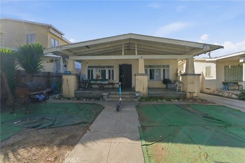 Photo of 1650 W 38th Place Pl, Los Angeles, CA 90062 (MLS # DW26040198)