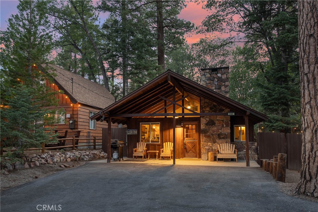 Welcome to your mountain retreat in one of Big Bear’s most desirable neighborhoods—lower Moonridge. Tucked on a rare, sprawling 7,500 sq ft lot, this charming and updated 1-bedroom, 1-bathroom cabin offers a peaceful, park-like setting with access to the National Forest right out the back gate. Step inside and feel instantly at home. The open floor plan features vaulted ceilings that give the cozy interior a bright, airy feel, while the beautiful stone fireplace creates a perfect focal point for relaxing evenings after a day on the trails. The cabin has been thoughtfully upgraded with dual pane windows, updated electrical and plumbing, and more—giving you modern comfort without losing the rustic charm. Whether you’re enjoying your morning coffee under the pines, grilling on the deck, or heading straight out for a hike, this property is all about lifestyle. The fully fenced yard provides privacy and room to roam, and there’s even RV and boat parking—rarely found in this area. Located just minutes from Bear Mountain Resort, the golf course, zoo, and Moonridge shops and dining, this cabin makes an ideal weekend getaway, vacation rental, or full-time home base. Properties like this—with space, updates, and unbeatable access to nature—don’t come around often. Come experience what makes lower Moonridge so special and why this hidden gem is a must-see.