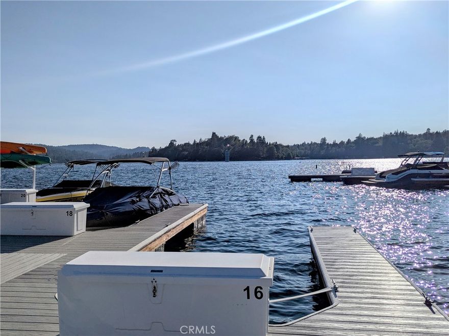Deep-Water Dock in Prime Location! FULLY REBUILT in 2024 with new Trex decking, brand-new storage box, new anchors, cleats, and more. Your new dock is secured with a gated entry and offers space to add your own kayak storage. Located just steps from the beach, restrooms, and Peninsula Park—featuring picnic tables, BBQ areas, and a children’s playground. Ideal for relaxing lake days and one of the best spots to enjoy fireworks during the amazing 4th of July show on the lake!