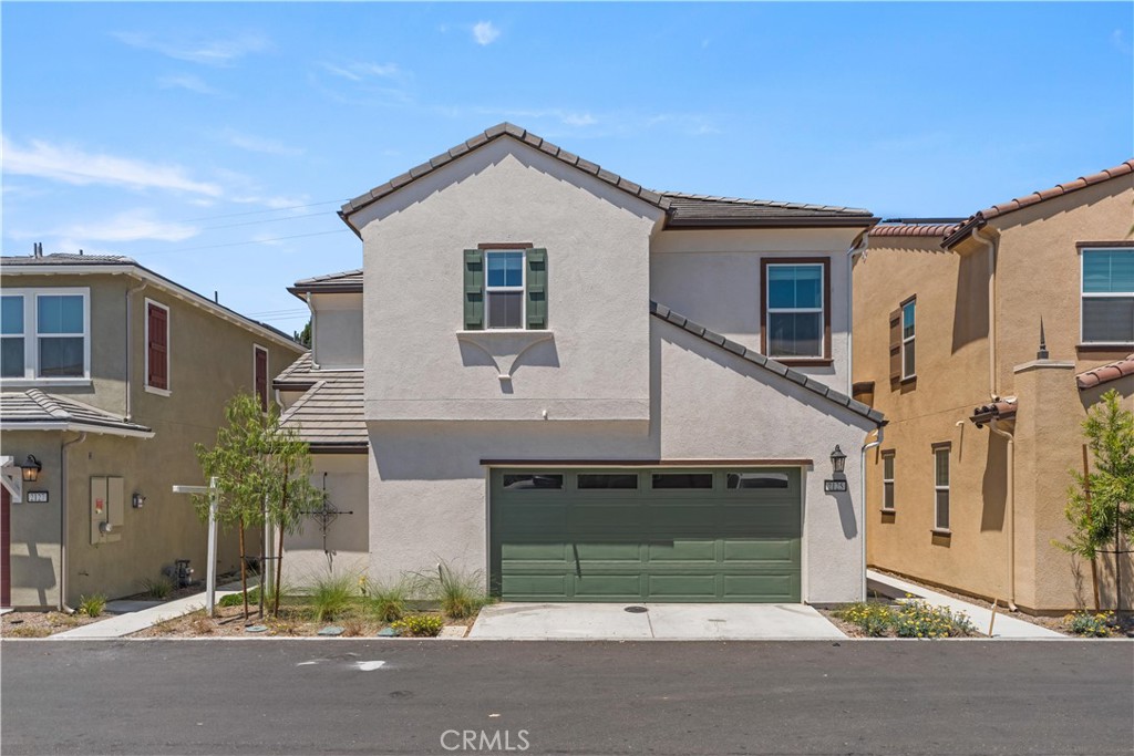 Motivated seller!!! Welcome to this beautifully upgraded 3-bedroom, 2.5-bathroom home offering 1,891 sq ft of modern living in the desirable Gateway residence of Pomona. This two-story home boasts an open-concept layout featuring a bright great room and a stylish kitchen with upgraded cabinetry, quartz countertops, and a spacious center island—perfect for entertaining.
Upon entry, you’re greeted by a welcoming foyer and a versatile flex room on the right, ideal for a home office with a convenient half bath next to it. Upstairs, the primary suite features a walk-in closet and a luxurious en suite bath with dual sinks, soaking tub, and separate walk-in shower. Two additional bedrooms share a full hall bath, and a spacious loft provides additional living space. The upstairs laundry room includes both gas and electric dryer hookups for added flexibility. Additional upgrades including: new hardwood flooring on stairs and loft, a wireless garage door pad, and plus entry courtyard space with low-maintenance landscaped backyard with concrete patio, artificial turf, planting beds, and an automatic irrigation system. Smart home features include a Schlage electronic front door latch, IQ Panel for device control, Ecobee smart thermostat, and Eero mesh Wi-Fi system for robust connectivity throughout. It also features a spacious 2-bay garage with additional storage space, offering plenty of room for vehicles and belongings. Prime location just minutes from Costco, 85°C Bakery, Crossroads Marketplace in Chino Hills, major freeways, shopping centers, and Cal Poly Pomona. Walking distance to Philadelphia Elementary and Garey Senior High School. Don’t miss this move-in-ready gem!