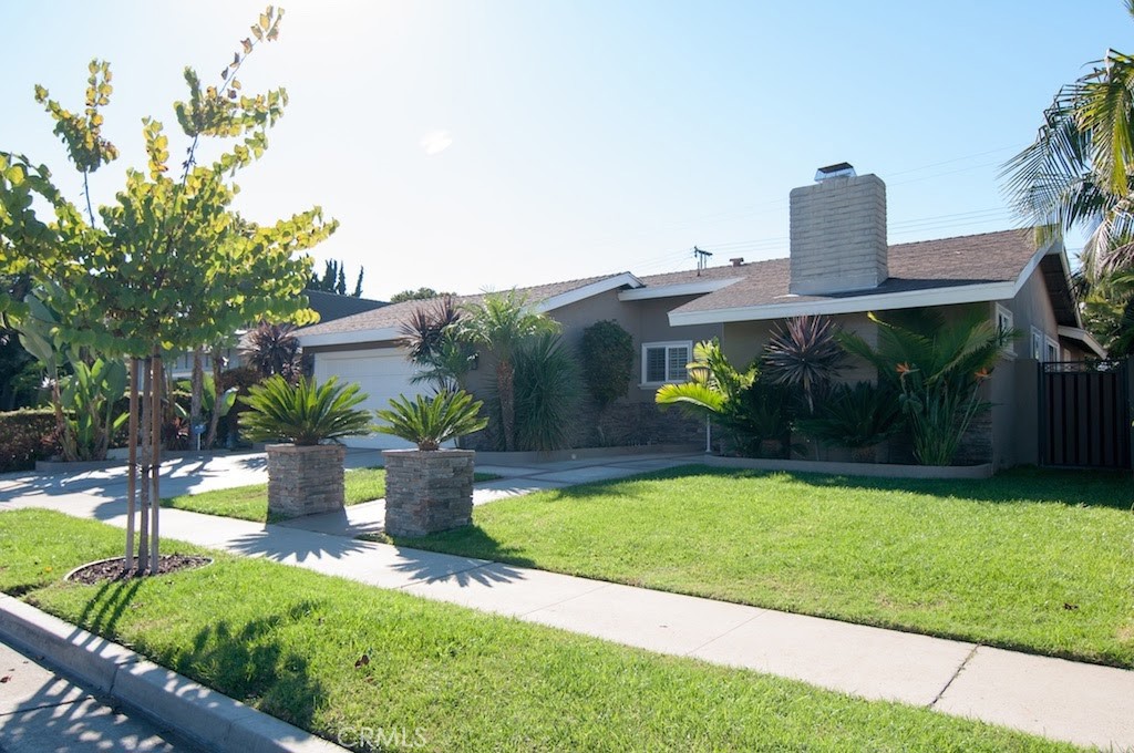 This beautifully designed 3-bedroom, 2.5-bathroom home offers 1,340 square feet of living space with an open floor plan that’s perfect for both everyday living and entertaining. The kitchen features granite countertops, a spacious island, GE Profile stainless steel appliances, and a Bosch dishwasher. Newly refinished hardwood floors run throughout, fresh paint, paired with dual pane windows, custom shutters, crown molding, and ceiling fans in every room. French doors off the living area open to the backyard for seamless indoor-outdoor living. Both bathrooms are filled with natural light from skylights and are finished with stone showers and stone flooring. The private backyard is built for entertaining with a custom BBQ island, granite counters, under-counter kegerator, refrigerator, pizza oven, storage, and two fire pits. Block walls and powder-coated side gates add privacy and style. Additional features include an attached two-car garage with washer and dryer hookups, plus excellent curb appeal with stone trim, foam-trimmed windows, and an inviting entryway.