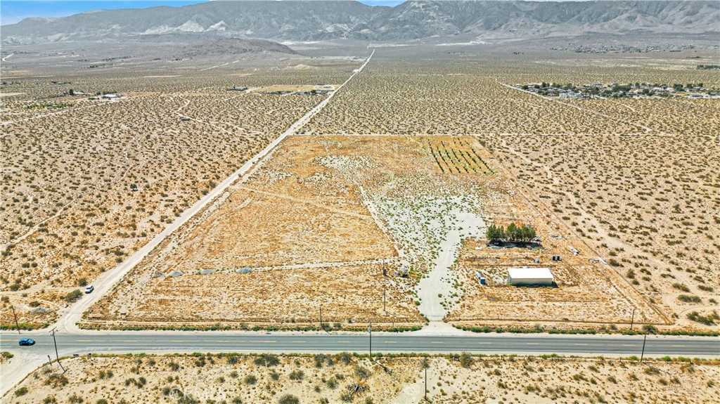 Legal Marijuana Grow (2023) - Subject to City of San Bernardino Approval.
Approximately 20.31 acres of flat residential land located in Lucerne Valley, strategically situated at the intersection of Hwy 247 (Old Woman Springs Rd) and Meridian Rd. This fully fenced property is equipped with 3-phase electricity and a water well tapping into an underground river approximately 400 feet below, providing an unlimited water supply. The property also features a fully insulated storage building of approximately 1,000 square feet. Zoned for single residential use with a 10,000 square foot minimum, this land represents a significant future investment opportunity.