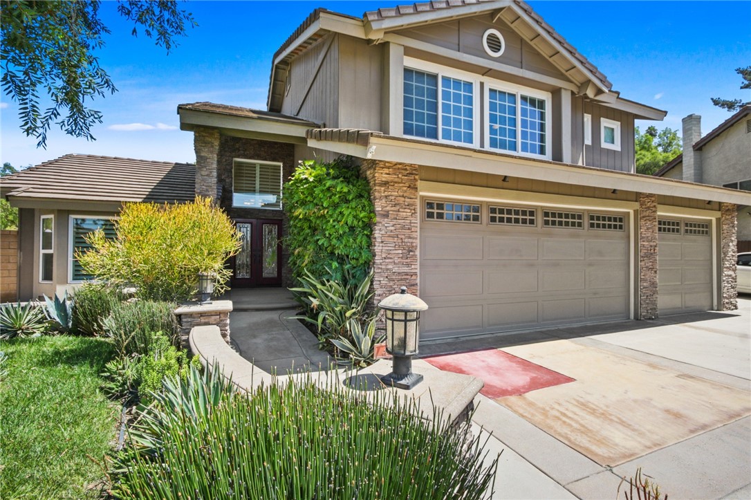 Step through welcoming double entry doors into a bright foyer leading to a formal living room accentuated by vaulted ceilings. The living spaces flow gracefully into an open kitchen and family room, offering seamless indoor-outdoor connectivity and a cozy fireplace ideal for relaxation. The kitchen features granite countertops, a large island, and stainless-steel appliances, providing both efficiency and elegance. Upstairs, the primary suite hosts vaulted ceilings, a spacious walk-in closet, a dual-sink vanity, and a soaking tub/shower combo—your private oasis of comfort. Three additional bedrooms and a full bathroom complete the upper level, offering flexible accommodation. ***PROPERTY HIGHLIGHTS*** Soaring vaulted ceilings in living and primary rooms Bright, spacious formal living and dining areas Open-concept kitchen with granite countertops, island, and stainless appliances Family room with fireplace and direct backyard access Luxurious primary suite walk-in closet and spa-style en suite Three additional well-appointed bedrooms upstairs Professionally landscaped backyard retreat Shaded Pergola ideal for outdoor entertainment Gated RV access and wide side yards