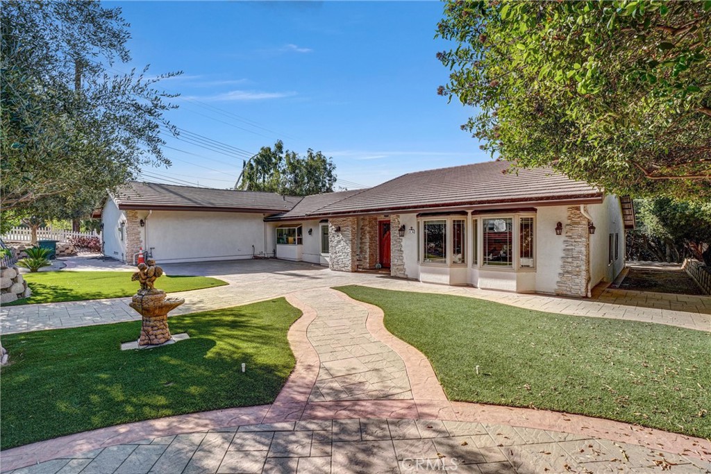 First time on the market since 1990! Nestled on a desirable corner lot in Pasadena’s Villa Highlands, this 4-bedroom, 3-bath residence was fully rebuilt to the studs in 2015 and has been lovingly and meticulously maintained. The open floor plan showcases a formal living room, family room, and charming breakfast nook. The elegant kitchen offers bay windows with front yard views and a commercial-grade exhaust for gourmet cooking. The master retreat features vaulted ceilings and a spa-inspired bath with a towel warmer. Additional highlights include synthetic hardwood floors made in Italy, bidets in all bathrooms, abundant natural light, and refined finishes throughout. Outdoor living is complete with a spacious covered patio, mature fruit trees, and a 3-car garage with custom wood design doors—perfect for entertaining or relaxing in style.