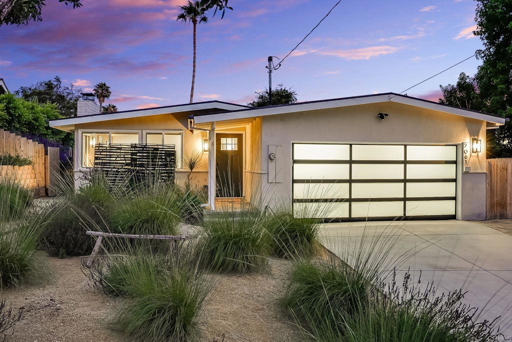 Beautifully reimagined in 2023 and enhanced further in 2024, this single-level stunner in the heart of Olde Carlsbad offers refined coastal living just blocks from Carlsbad’s top-rated schools, charming village, and iconic beaches. Enjoy ocean and sunset views from your private backyard retreat with paver patios, lush sod, new fencing, and gated RV parking. Inside, the open-concept layout is flooded with natural light and elevated by wide-plank LVP flooring, skylights, dual-pane windows, and a rebuilt fireplace with remote-operated gas log set. The chef’s kitchen features quartz countertops, custom cabinetry with pull-out drawers, and a premium stainless appliance package including a Samsung Bespoke refrigerator, KitchenAid dishwasher and range, and Breville convection microwave. Both bathrooms have been fully renovated with high-end finishes, including Toto Neorest smart toilets and a glass-enclosed walk-in shower in the primary suite. The finished garage is an added bonus with epoxy floors, built-in cabinetry, its own HVAC unit, sink, and front-loading washer and dryer—ideal for a home gym or workshop. Additional upgrades include a new AC and furnace, tankless water heater, upgraded electrical panel, recessed lighting, digital entry, and a new garage door with keypad. A newer torch-down roof (2023), added attic insulation, gutter system, and improved drainage complete this meticulously upgraded home.