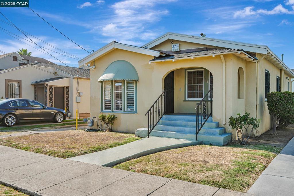 Open House: Saturday, 9/27 from 12pm - 3pm and Sunday, 9/28 from 12pm - 3pm. Classic Oakland bungalow with timeless charm and exceptional potential, ideally located near the San Leandro border. The light-filled living room features an elegant arched front window and a decorative fireplace, creating a welcoming focal point. Floor plan includes two bedrooms, a spacious dining area, an inviting breakfast nook, and a dedicated laundry room. The private backyard is perfect for gatherings, while the long driveway provides ample off-street parking and leads to a detached garage with ADU or creative space potential (buyer to verify). Minutes from San Leandro BART, AC Transit, Oakland International Airport, and 880/580 freeways, this commuter-friendly home also offers close access to neighborhood schools, parks, and amenities. With strong bones and classic architecture, 1921 106th Ave is ready for updates that will unlock its full potential. Property is sold as-is, presenting an excellent opportunity to create your ideal home or secure an investment with lasting value.
