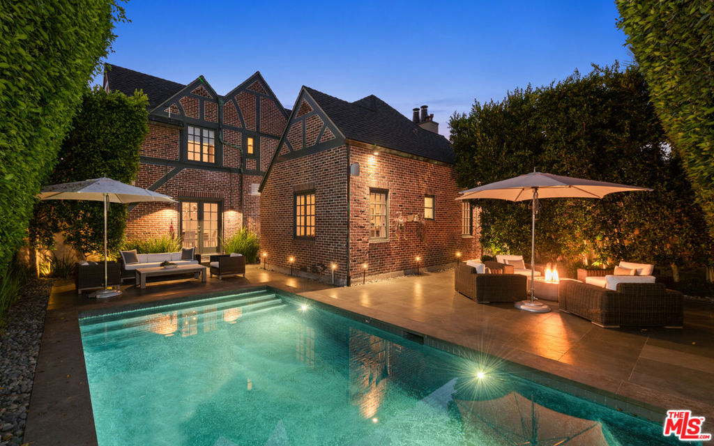 Welcome to a world of refined elegance and modern comfort with this exquisite fully remodeled contemporary Tudor residence. Nestled within a gated private compound on the idyllic "Little Bronson" in Windsor Square sits this architectural masterpiece boasting five spacious bedrooms, an inviting office space, and a mother-in-law quarters, ensuring ample space for both living and working. The seamless fusion of contemporary design and charming finishes creates an ambiance that is both captivating and timeless. Gleaming hardwood floors lead you through the sun-kissed living spaces adorned with expansive windows that allow the beauty of natural light to flood the rooms. The heart of this stunning home lies in its meticulously designed kitchen, where sleek countertops and state-of-the-art appliances harmonize seamlessly with the warmth of wood accents. Whether you're hosting a formal dinner or an intimate gathering, the alfresco dining area provides the perfect setting, surrounded by lush landscapes that evoke a sense of tranquility. Retreat to the luxurious bedrooms, each a haven of comfort, with contemporary aesthetics and ample storage. The primary suite is a sanctuary of relaxation, offering a private escape with spa-like en-suite facilities. Outside, a shimmering pool beckons, inviting you to bask in the sun or unwind with a refreshing swim. The sprawling grounds are a symphony of color and texture, with meticulously manicured lawns and vibrant foliage that enhance the overall sense of serenity. Immerse yourself in the beauty of its design, the serenity of its surroundings, and the allure of its thoughtful features a truly exceptional living experience that captures the essence of both contemporary sophistication and timeless allure. Seller will entertain a long term lease.