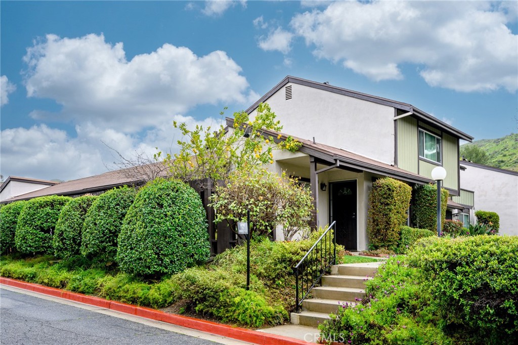 Fully remodeled and move-in ready, this beautiful 2-bedroom condo offers comfort and convenience in sunny Sunland, CA. The modern kitchen features stainless-steel appliances, and the spacious bathroom includes a double-sink vanity. Large windows throughout let in abundant natural light with serene views of nature and the Angeles Forest mountains, and only one shared wall for added privacy. The spacious attached patio is perfect for relaxing or entertaining. Additional perks include in-unit laundry, central AC, a private 2-car attached garage with extra storage, on-site tennis court and pool, and ample guest parking within this gated community. Centrally located near Burbank and Glendale, with easy access to La Crescenta, grocery stores, hiking trails, and the 210 freeway — this home truly has it all. Don’t miss out!