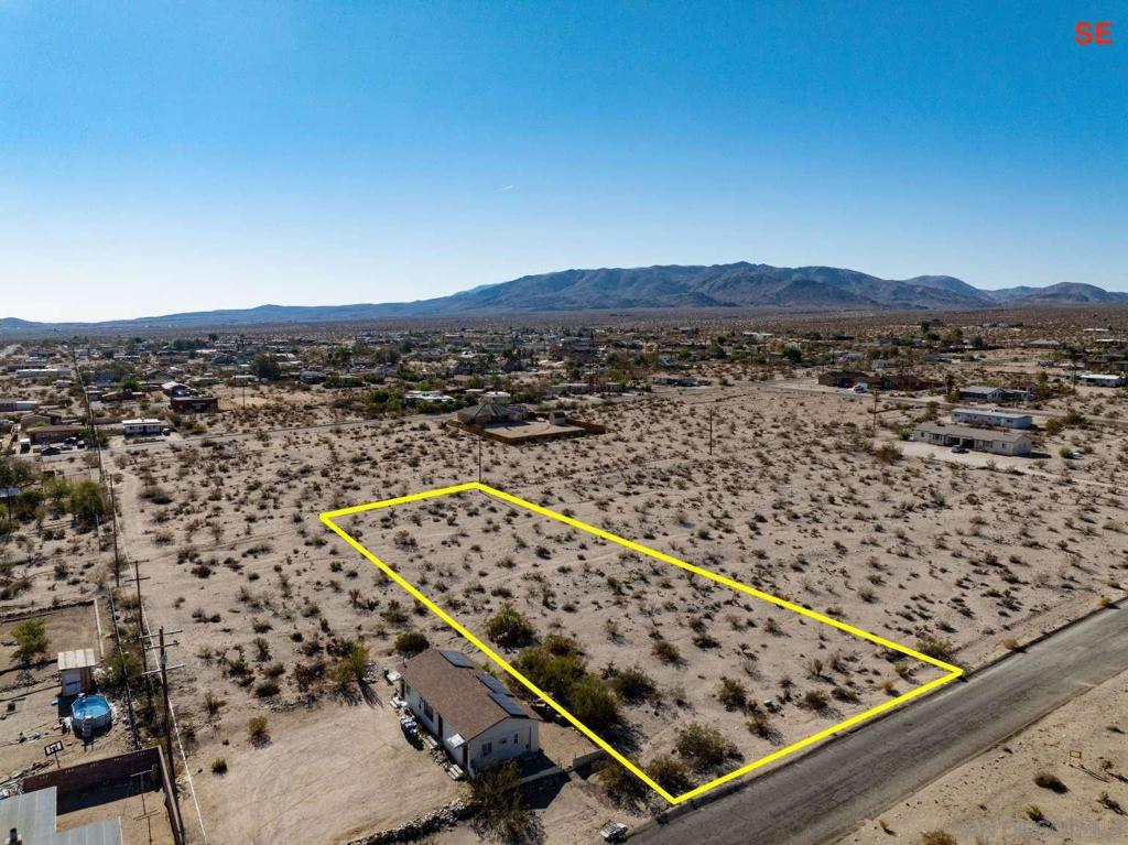 This 0.69-acre property is in Twentynine Palms, San Bernardino County with paved road access and nearby power and water lines! It sits in a quiet and growing neighborhood just a short drive from restaurants, shops, and other town conveniences. The lot is ready for future use and offers flexibility for building or investment. It is located near Knott Sky Park and Palm Vista Elementary School which adds to its appeal. The area has a peaceful desert setting while staying close to city services. This is a solid choice for anyone looking for space in a well-connected location!
