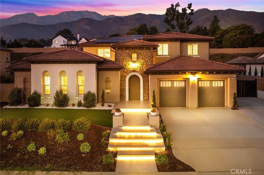 Located in the prestigious iron-gated community of Weaver Lane Estates — an exclusive enclave of just 26 luxury residences — this exceptional 2022-built home offers the finest in upscale living on a generous 20,007 sq ft lot (0.46 acres) with a desirable south-facing orientation. A wide, grand front yard creates a striking first impression, leading to a private auxiliary building with its own bedroom and bathroom, perfect for guests, extended family, or rental opportunities. Beyond the entry, a beautifully designed central courtyard seamlessly connects the auxiliary building and the main building, bringing abundant natural light and excellent indoor-outdoor flow. Inside the main building, a spacious foyer opens to a private home office to the right, followed by a soaring great room, a gourmet kitchen with a large center island, a separate wok kitchen, a formal dining room, a full guest suite, and a convenient powder room for visitors. Upstairs, a large loft-style living area provides flexible space for a secondary family room, along with two expansive junior suites and a grand primary suite offering impressive space, a luxurious spa-like bathroom, and a generous walk-in closet. Additional features include an extra-long driveway, side yard parking ideal for RV or boat storage, and a 3-car attached garage. Zoned for the highly rated Alta Loma School District, this property offers a rare opportunity to own a newer luxury home with privacy, prestige, and convenience in one of Rancho Cucamonga’s most exclusive communities.