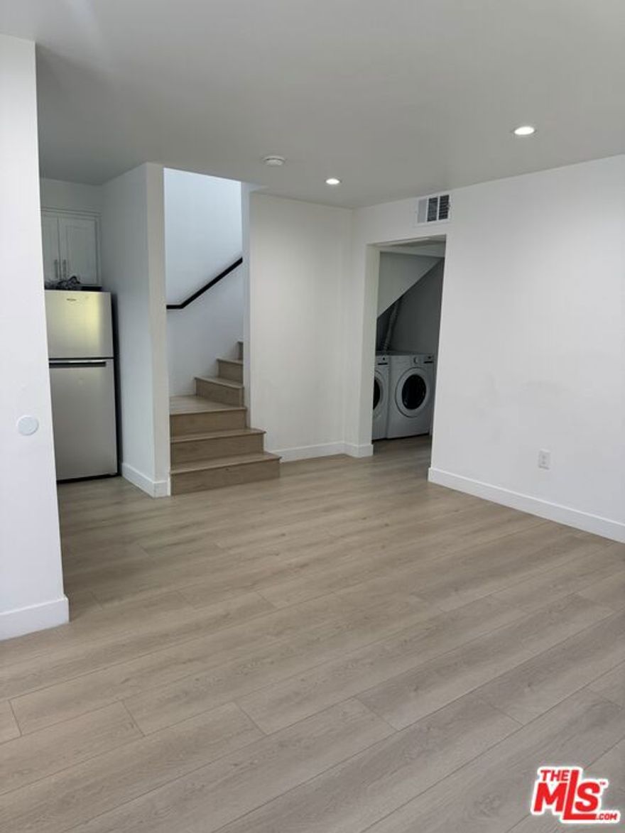 Be the first to live in this newly built two-story residence in the heart of Leimert Park. This modern home offers about 1,000 square feet of bright, open living space with laminate wood flooring, high ceilings, and recessed lighting throughout. Enjoy central air and heat, an in-unit washer and dryer, and solar panels to help reduce electricity costs. The kitchen is equipped with stainless steel appliancesrefrigerator, oven with stove, and microwave hoodwhile the Carrera marble bathroom adds a clean, modern touch. The home also features ample closet space and is part of a secured building with surveillance cameras and coded entry for added peace of mind.