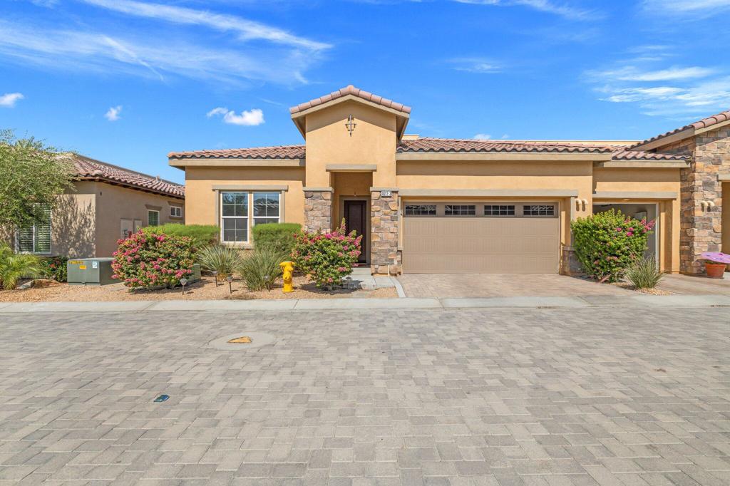 Turnkey Furnished Ravello Collection Granada Model in Premier 55+ Community. This beautifully upgraded 3-bedroom, 2-bath home is located in the sought-after Villa Portofino community. Enjoy the privacy of a pavered front courtyard and a covered loggia--perfect for relaxing or entertaining. The open-concept floor plan features wood-look tile flooring, carpet in the bedrooms, and a stylish kitchen with white cabinetry, quartz countertops, a large island, stainless steel appliances, a designer backsplash, and recessed lighting. The spacious primary suite includes a generous walk-in closet and a large bathroom. Energy-efficient upgrades include a tankless water heater, EV charger, and solar panels. Enjoy resort-style living with access to the 30,000 sq ft clubhouse offering a private 100-seat movie theater, cafe and dining room, pool and spa with cantina, a state-of-the-art fitness center, social activities, and more. The low HOA dues include landscape maintenance and a cable package--offering unbeatable value.
