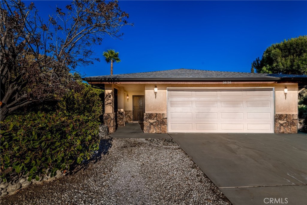 26126 Marshall Ave, Hemet, CA 92544 is a stunning single-story gem nestled on a spacious lot. This beautifully updated home features 3 bedrooms, 2 bathrooms, a welcoming living room, and a cozy family room highlighted by a striking brick fireplace. The kitchen flows seamlessly into the dining area, perfect for entertaining. Enjoy the luxury of newer flooring throughout, a brand-new roof, and newer painted interiors that enhance the home’s modern appeal. The well-maintained front and back yards, complete with a mature palm tree and fenced backyard, offer ample outdoor space. Tucked beside a grove, this move-in-ready property blends charm and convenience, ideal for those seeking a turnkey residence.