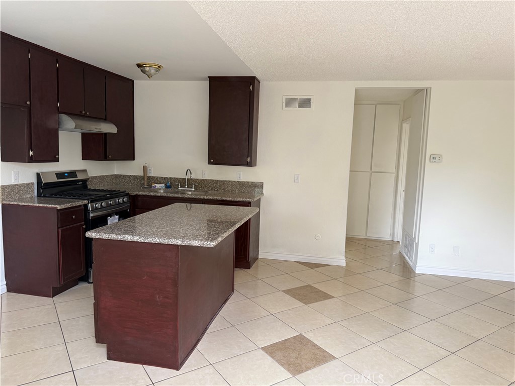 Located near shopping and freeway. This upstairs unit offers one bedroom and one bath. The apartment has been updated with new carpet, paint, stove, kitchen and bath. It has a one car garage and a community laundry room. Rent includes water and trash. Tenant is to verify all information with the owner.