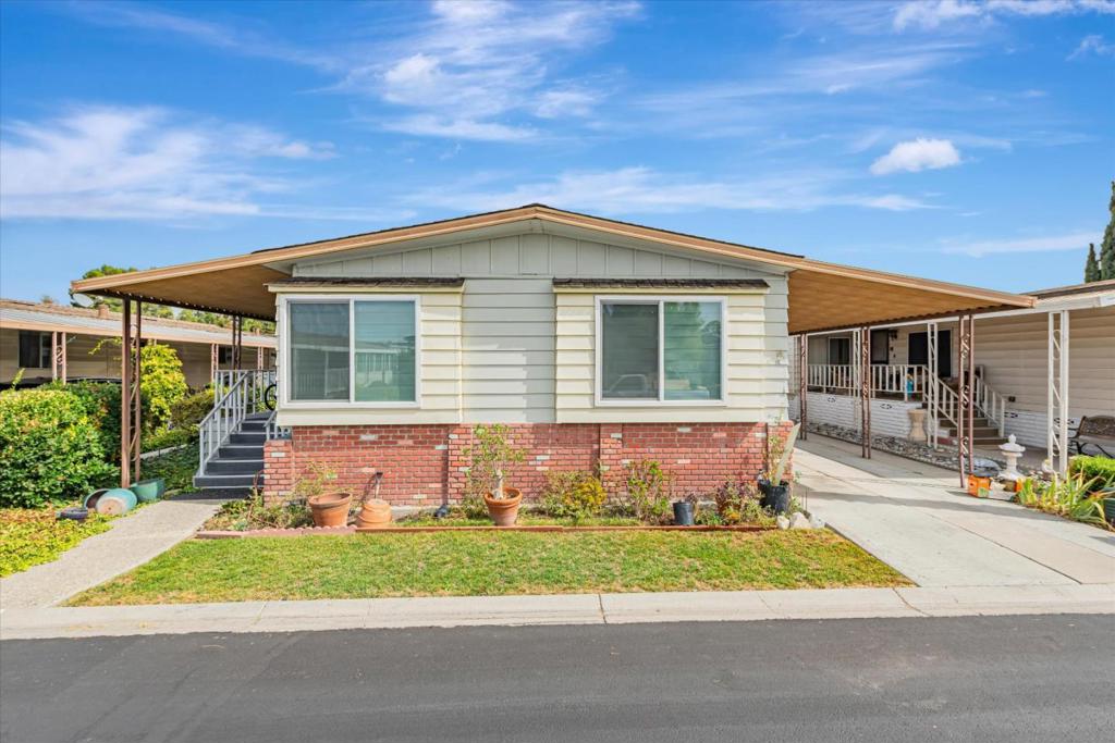 Welcome to this beautifully maintained 1977 mobile home, nestled in one of San Joses most desirable 55+ senior communities. Bursting with curb appeal and character, this 2-bedroom, 2-bathroom home offers a warm and inviting atmosphere throughout. Step inside to a spacious layout featuring both a large living room and a separate family roomideal for entertaining or relaxing. The home features brand new windows, laminated wood flooring, and a totally remodeled kitchen complete with modern cabinetry, subway tile backsplash, and elegant stone countertops. The primary suite offers a peaceful retreat with a sliding-door closet and an ensuite bathroom with a shower over tub. The second bedroom is generously sized and includes ample closet space. Outside, enjoy the benefits of community living with access to scenic walking paths and nearby parks. Plus, youll love the convenience of being just minutes from shopping, dining, and everyday essentials. Dont miss the opportunity to own a move-in ready home that blends comfort, style, and convenience in a vibrant senior setting.