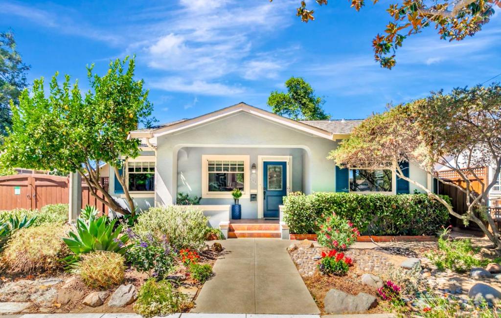 Set on an expansive 7,800 sq. ft. lot near the highly sought-after Naglee Park neighborhood, this beautifully remodeled 3-bed, 3-bath Craftsman blends character with thoughtful modern upgrades across 1,541 sq. ft. of living space-ideal for multigenerational living, extra rental income, or flexible use. The home features a smart layout with two en-suite bedrooms, each offering stylish finishes and privacy. The spacious primary suite is a standout, with its own entrance, full bath, and kitchenette hookup, making it easily convertible into a private studio-perfect for in-laws, or short-term rental. Adding even more versatility, the property includes a fully furnished detached mobile ADU in the backyard, complete with its own entrance, laundry, and private yard-ideal for Airbnb, rental, or additional living space. Energy-efficient solar panels and a Tesla Powerwall provide significant utility savings and peace of mind with backup power. The landscaped yard is a tranquil outdoor retreat with mature fruit trees, drought-tolerant plants, and low-maintenance design. Located on a quiet, tree-lined street minutes from downtown San Jose, San Jose State University, and major employers, this rare and versatile property offers the perfect balance of comfort, functionality, and long-term value.