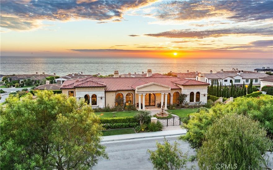 Built in 2015 with extraordinary attention to detail, this custom villa in Oceanfront Estates makes a timeless artistic statement. From the moment you step onto the oversized corner lot, the home radiates elegance while remaining warm and comfortable. The dramatic entry, framed by natural limestone columns, introduces a sweeping double staircase, Italian marble and hardwood floors, and oversized windows and doors showcasing ocean views from nearly every room.



The main level offers effortless single-level living with no steps and includes the impressive primary suite with a huge walk-in closet and spa-like bathroom, a handsome library, gracious living and family rooms, and a chef’s kitchen anchored by a spectacular marble island and supported by an adjacent catering kitchen.



Entertaining is effortless indoors and out. The backyard is a private retreat with a resort-style pool and spa, expansive loggia, built-in BBQ, multiple grass areas, and fruit trees. On the lower level, a second family/entertaining room, four oversized bedroom suites, a private theater, a wine cellar, and a 3-car garage with gated driveway provide unparalleled flexibility.



With four fireplaces, an elevator, air-conditioning, and ocean-view terraces, this estate is equally at ease hosting a grand dinner party or a casual evening at home. A rare combination of craftsmanship, comfort, and location.