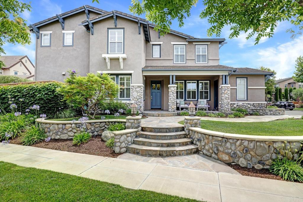 Set on a prime corner lot in the heart of Ladera Ranch, 15 Pleasanton Lane blends timeless Craftsman architecture with thoughtful modern updates and amazing curb appeal. Offered by the original owner, this home has been meticulously maintained, reflecting extreme pride of ownership throughout. With 5 bedrooms plus a loft, including a first-floor bedroom and full bath, the home offers a flexible and functional layout suited for a variety of needs. Step inside to find engineered hardwood flooring throughout the first floor, fresh interior paint with crown molding, and a bright, open floorplan. The main level includes a large formal dining room, a comfortable family room with media niche and fireplace, and a gourmet kitchen featuring a center island, double oven, and built-in range. Upstairs, you'll find spacious secondary bedrooms, a versatile loft perfect for a home office or media space, a convenient laundry room with sink, and a private primary suite with a walk-in closet and a luxurious bath with a jetted tub and separate shower. The backyard is a relaxing retreat with flagstone hardscaping, a new pergola, tranquil fountain, and mature landscaping. In the front yard, a thriving tangerine tree produces 300+ fruits annually, adding charm and character to the home’s welcoming exterior. Key Features & Upgrades: * Paid-off solar panels ($22,000, installed 2023) * Finished 2-car and single-car garages * Dual-zone A/C * Recirculating hot water system * Soft water system * Tile roof * Plantation shutters throughout * Exterior painted in 2023; interior in 2024 * New carpet (2024). Located just steps from the park and playground at the end of the cul-de-sac, and a short walk to the Oak Knoll Village Clubhouse, this home offers access to all the amenities Ladera Ranch is known for—resort-style pools, tennis courts, clubhouses, water parks, hiking and biking trails, and community events year-round.