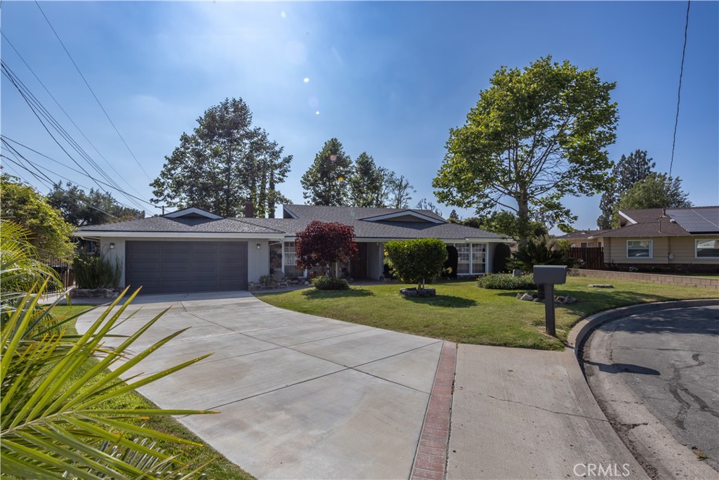 Charming Single-Story Home on a Quiet Cul-de-Sac in Yorba Linda. Welcome to this well-maintained 4-bedroom, 2-bath single-story home, located on a peaceful cul-de-sac in the heart of Yorba Linda. With approximately 1,867 square feet of interior living space and an additional 264 square feet of enclosed patio, this home offers a flexible layout ideal for comfortable everyday living. Set on a generous 12,000 square foot lot, the backyard features a park-like setting with mature fruit trees and ample space to relax or entertain. Inside, the home includes a formal living room and a dining area off the kitchen, which features granite countertops, a brand-new gas oven, and a walk-in pantry. Recent improvements include fresh interior paint, new flooring in the primary bedroom, and updated bathrooms. Hardwood-style vinyl flooring runs throughout the home, offering both durability and style. A dedicated laundry room is located just beyond the enclosed patio. Additional features include a two-car garage, an extended driveway for extra parking, and placement within the award-winning Placentia-Yorba Linda Unified School District. Available at the end of the month. Minimum one-year lease required. Pets considered — please call for details
