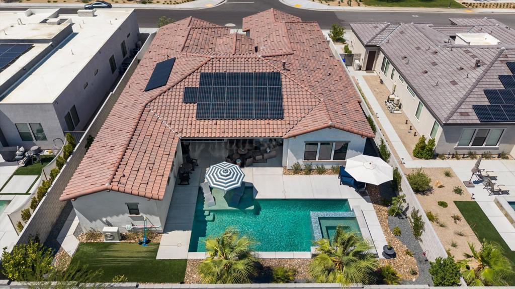 Personality and energy efficiency come together in this spacious, HIGHLY UPGRADED, 5 bedroom, 4 1/2 bath home in the 2023-built Montage community of Palm Desert! With nearly 3300 sq ft of living space, remain comfortable with 24 OWNED SOLAR panels and 2 BATTERY storage systems. This stylish GHA-built LX-series property features a great room, plus plenty of areas to spread out with a detached backyard casita, separate media/club room and office spaces. Easily add a home gym by converting the 3rd car garage. The SOUTH-FACING, PRIVATE BACKYARD OASIS was recently completed and features nearly new equipment, a salt water POOL and raised, oversized SPA, built-in BBQ island, MISTERS and integrated SONOS speaker system. Appreciate all the CUSTOMIZATIONS that turned this new build into a HOME: including wood-look tile plank flooring throughout, high-end soft-close thermofoil cabinets, top-of-the-line LG appliances, designer lighting, water purification, decorative shelves, barn doors, window treatments, a primary walk-in CLOSET FIT FOR ROYALTY, and the list goes on! Montage is CENTRALLY LOCATED to all the Coachella Valley has to offer, including an 8-MIN COMMUTE to Eisenhower Med Center, Xavier Prep, Desert Willow Golf Resort, DSRT Surf Park and 10 MIN to El Paseo Shopping, Dining & Art. UNBEATABLE VALUE and appraised WELL ABOVE asking price, make an appointment today before it's gone!