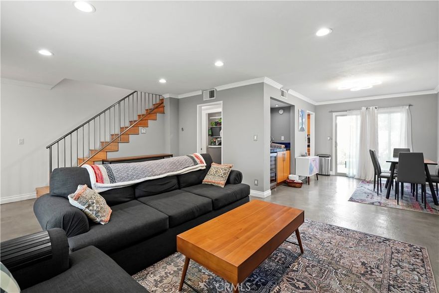 Welcome to this spacious 1,346 sq. ft., two-story townhome in a desirable Valley Glen area. This unit features two primary suites with large closets and 2.5 upgraded bathrooms.

The chef's kitchen has top-of-the-line Jenn-Air appliances, including two dishwashers. The living room offers a cozy atmosphere with a functioning gas fireplace, and the adjacent dining area is perfect for entertaining with a wet bar and wine fridge.

Enjoy California indoor-outdoor living with a large front patio, a private balcony off one primary bedroom, and a large back patio with mature landscaping, all accessed through upgraded sliding doors.

Additional features include two side-by-side underground parking spaces. Located at 6332 Fulton Ave #109, the property is close to Los Angeles Valley College and Valley Glen Community Park and has easy access to freeways, entertainment, and retail.