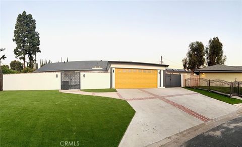 Photo of 17965 Wellington Ave, Tustin, CA 92780 (MLS # PW26054201)