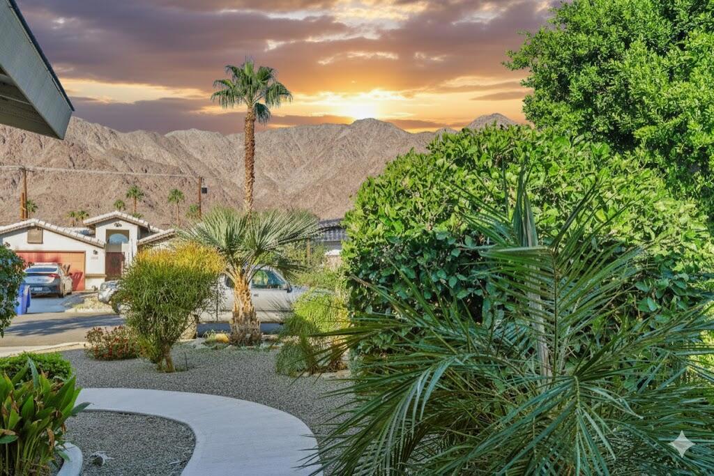 Charming La Quinta Cove Home with Mountain Views & Solar!Nestled on a quiet street near historic Old Town La Quinta, this beautifully maintained home combines charm, comfort, and desert lifestyle appeal. Enjoy spectacular mountain views from the front and a bright, open floor plan with abundant natural light. The updated kitchen features rich natural pine cabinetry, granite countertops, and stainless-steel appliances, opening to a cozy dining area and spacious living room, ideal for everyday living and entertaining.Energy-efficient leased solar panels, dual-pane windows, and upgraded lighting add value and peace of mind. The primary suite offers a private en-suite bath, while two additional bedrooms provide plenty of space for family, guests, or a home office.Step outside to the private, south-facing backyard with a shaded patio and low-maintenance landscaping, perfect for relaxing, barbecuing, or enjoying the mountain backdrop. The attached two-car garage provides secure parking and extra storage.Located minutes from hiking and biking trails, parks, top-rated schools, and Old Town's shops and restaurants, this move-in ready La Quinta Cove gem checks every box for comfort, efficiency, and style!