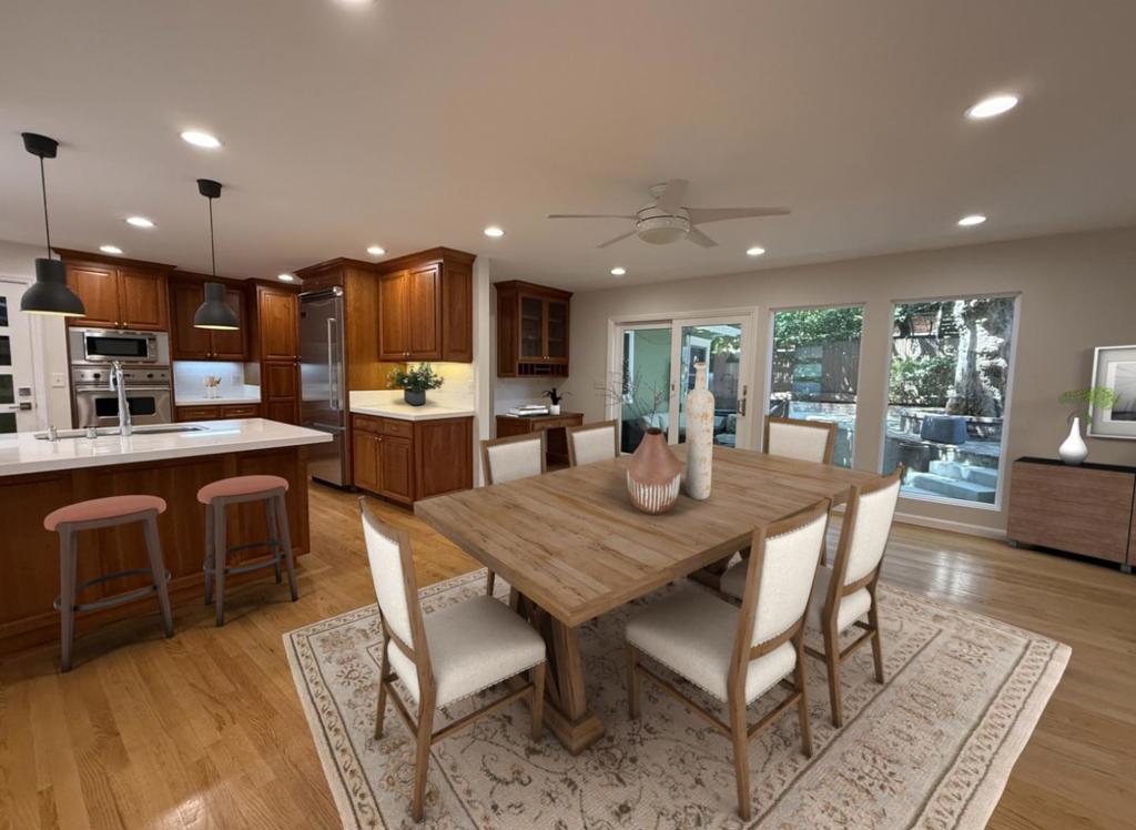 Within walking distance to downtown San Carlos, this spacious two-story home in desirable Howard Park offers 5 bedrooms and 3.5 baths, blending quality craftsmanship with modern updates. The main level features hardwood floors throughout a bright living room with fireplace, two bedrooms, a full bath & an open-concept kitchen/dining area. The kitchen includes Viking stainless-steel appliances, double ovens, abundant cabinet storage, a breakfast bar, built-in desk & a wall of windows overlooking the backyard. Open to the dining area with direct access to the yard, the layout is ideal for everyday living & entertaining. Outside, the backyard offers two seating areas, fruit trees & a built-in bar with stools. A mature London plane tree provides natural shade and privacy. Upstairs, the primary suite features three closets, a private deck, dual sinks, a soaking tub & separate tiled shower. Two additional bedrooms share a full bath with shower over tub, next to a large family room & laundry room with washer/dryer, cabinets, folding counter & deep sink. Fresh paint, new carpet & a welcoming front porch complete the home. Attached garage offers storage space & a built-in workbench. With easy access to Highways 101/280, this home delivers comfort & space in a prime San Carlos location.