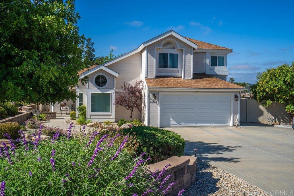 **Value Range Pricing $790,000-$775,000** Welcome to 23847 Norte Dr., a beautifully maintained 3-bedroom, 2.5-bath home nestled on a quiet cul-de-sac in the highly desirable San Diego Country Estates of Ramona. This spacious 1,950 sq ft property sits on just under half an acre and blends comfort, elegance, and sustainability—perfect for those seeking both peace and practicality. From the moment you arrive, you’ll be captivated by the professionally designed landscaping featuring custom pavers and a tranquil water fountain at the covered front patio—an inviting space to relax or greet guests. Step inside to discover an elegantly remodeled kitchen that serves as the heart of the home. With updated appliances and stylish finishes, it’s perfect for both everyday living and entertaining. The open-concept floor plan features gorgeous hardwood floors throughout the main level, adding warmth and sophistication. The main-floor primary suite offers comfort and convenience with French doors that lead directly to the serene backyard patio. Both the master and guest bathrooms have been tastefully renovated with high-end finishes, creating peaceful spaces to unwind. This energy-efficient home includes owned solar panels, vinyl dual-pane windows and sliders, and a newer HVAC system with a whole-house attic fan—ensuring year-round comfort and low utility costs. The professionally landscaped backyard is a true retreat, featuring custom pavers, mature trees, and a pergola-covered patio—ideal for outdoor entertaining or quiet evenings at home. You’ll also find a fully finished detached studio shed complete with plank flooring, a sink, and its own AC unit—perfect for a home office, gym, or art studio. Additional features include: Rear yard access ideal for RV, boat, or trailer parking, along with two large Tuff Sheds for extra storage. Proximity to Ramona’s charming downtown and all San Diego Country Estates amenities, including parks, trails, golf, tennis, and equestrian centers. This turn-key Ramona home for sale offers a rare combination of peaceful living and modern convenience. Don’t miss your opportunity to own a stunning, energy-efficient home in one of Ramona’s most sought-after communities.