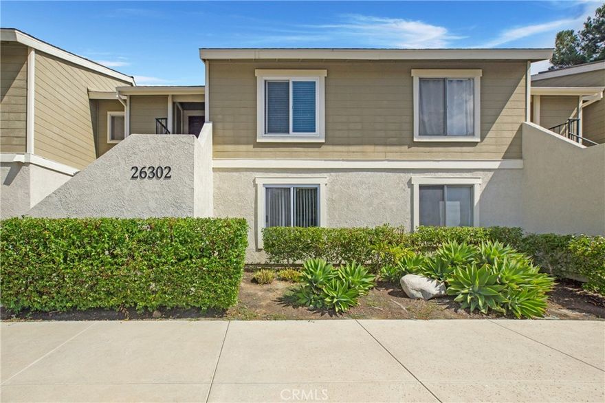 26302 Los Viveros #152D is an updated upper unit condominium in a prime Mission Viejo location. The property offers you 2 bedrooms, 1 bath and much more! Close to everything this darling home is waiting for the perfect Buyer. Recently painted and updated it is move-in ready. Kitchen has granite counters, recessed lighting and includes a refrigerator.  Flooring throughout is a combination of marble, laminate and tile.  Property is very light and bright. Living room has vaulted ceilings and ceiling fan. Balcony includes closet with washer/dryer hookups. Mirrored wardrobe doors in each bedroom. Ceiling fans keep the cool air running through and there are wall HVAC units to assist. Walk to Alicia Park and a variety of dining, banking, shopping & medical options. Plus, you are 5 minutes from the 5 Freeway!  This place is close to everything! Included in HOA is membership at the famed Lake Mission Viejo with a variety of recreational options. This could be a great place to begin your home ownership journey or as a potential investment.  At this price the options are many!