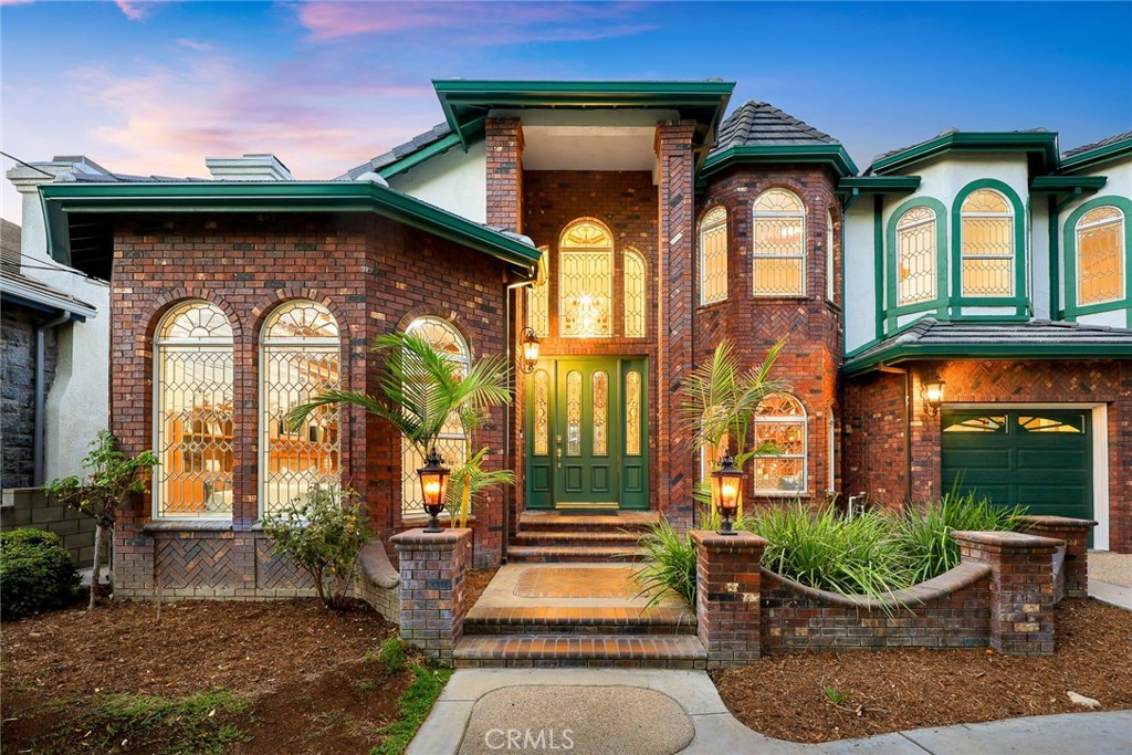 WELCOME TO THIS EXQUISITE CUSTOM-BUILT ESTATE, CRAFTED BY THE HIGHLY SOUGHT-AFTER MURISOL CONSTRUCTION, RENOWNED FOR CREATING EXCEPTIONAL, LUXURY HOMES IN ARCADIA. SITUATED ON AN EXPANSIVE 16,692-SQUARE-FOOT LOT ALONG THE ICONIC, PALM-LINED LONGDEN AVENUE, THIS FRENCH NORMANDY-INSPIRED MASTERPIECE SEAMLESSLY BLENDS OLD-WORLD CHARM WITH MODERN ELEGANCE.
6,186 SQUARE FEET OF LIGHT-FILLED LIVING SPACE, SHOWCASING GLEAMING HARDWOOD AND MARBLE FLOORS, SOARING CATHEDRAL CEILINGS, A GRAND SPIRAL STAIRCASE, AND CRYSTAL CHANDELIERS. WALLS OF CRYSTAL-EDGED GLASS AT THE FRONT OF THE HOME CAPTURE AND REFLECT SUNLIGHT, CREATING A BRIGHT, AIRY ATMOSPHERE THROUGHOUT. COMPLETELY REMODELED FROM THE GROUND UP, INCLUDING ROOF, FLOORS, KITCHEN & BATHROOMS, GARAGE DOORS, APPLIANCES, DECKS, AND ON.
HIGHLIGHTS INCLUDE:
6 BEDROOMS | 5 BATHROOMS
2 BEDROOMS ON THE MAIN LEVEL, IDEAL FOR GUESTS OR MULTIGENERATIONAL LIVING
4 BEDROOMS UPSTAIRS, INCLUDING A LUXURIOUS MASTER RETREAT
FORMAL LIVING & DINING ROOMS WITH RICH CUSTOM CEILING DETAILS AND TRADITIONAL COZY FIREPLACES
FAMILY ROOM WITH A FLOOR-TO-CEILING MARBLE FIREPLACE AND BUILT-IN BAR
GOURMET CHEF’S KITCHEN FEATURING A LARGE CENTER ISLAND WITH CORTZ COUNTERTOPS, HIGH-END WOLF AND SUB-ZERO APPLIANCES, AND A CHARMING BREAKFAST ALCOVE 
POST ALARM VIDEO SECURITY 
HALO 5 WATER SYSTEM
BRAND NEW SPLIT HEAT AND AIR CONDITIONING WITH DUAL ZONES 
BUILT-IN HOME OFFICE & LIBRARY WITH CUSTOM HARDWOOD CABINETRY
EXPANSIVE CIRCULAR DRIVEWAY FITS UP TO 6 VEHICLES
3-CAR ATTACHED GARAGE 
THE MASTER SUITE IS A TRUE SHOWSTOPPER—COMPLETE WITH A PRIVATE BALCONY, DRESSING AREA, FIREPLACE, SITTING LOUNGE, WET BAR, AND DUAL WALK-IN CLOSETS—THE PERFECT RETREAT AFTER A NIGHT OF ENTERTAINING.
STEP OUTSIDE THROUGH GRAND FRENCH DOORS TO A PROFESSIONALLY LANDSCAPED BACKYARD OASIS FEATURING A SPARKLING POOL, MATURE GREENERY, AND AMPLE SPACE FOR ENTERTAINING GUESTS.
ADDITIONAL FEATURES INCLUDE CUSTOM-BUILT HARDWOOD CABINETRY IN EVERY ROOM, SHOWCASING THE CRAFTSMANSHIP AND WARMTH THAT SET THIS HOME APART. A PRIVATE UPSTAIRS "MAZE LEVEL" CREATES A QUIET SANCTUARY FOR THE BEDROOMS, ADDING TO THE SENSE OF LUXURY AND PRIVACY.
LOCATED IN THE HEART OF ARCADIA, WITHIN THE AWARD-WINNING ARCADIA UNIFIED SCHOOL DISTRICT, THIS HOME OFFERS THE RARE COMBINATION OF SIZE, STYLE, CHARACTER, AND LOCATION.
IF YOU'RE LOOKING FOR A GRAND ESTATE WITH TIMELESS ELEGANCE AND MODERN LUXURIES—THIS IS YOUR FOREVER HOME.