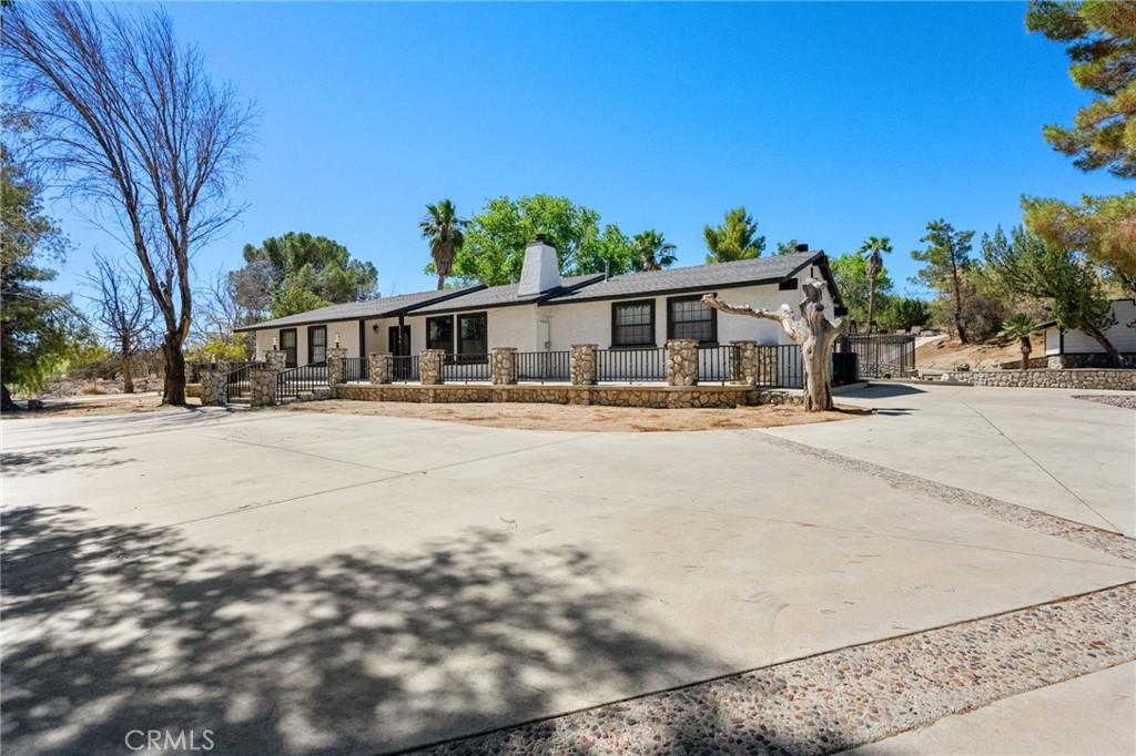 Words and pictures can’t fully capture the serenity and beauty of this sanctuary-like retreat—it must be experienced in person to be truly appreciated. Discover The Ranch—a truly one-of-a-kind property offering the peace and space of country living, sprawling across 3.49 acres (151,811 sq. ft.), this extraordinary, privately gated estate is unlike anything else on the market.
This charming ranch-style home featuring 3 spacious bedrooms and 2 bathrooms, designed for comfort and classic style. Step outside to enjoy your in-ground pool, ideal for relaxing and entertaining under the sun.
Also included is a detached 4-car garage with a beautifully finished 1 bed, 1 bath guest house—complete with air cooling and heating—perfect for visitors, extended family, or rental income potential.
The property is meticulously designed with extensive concrete work throughout: custom rock walls, winding walking paths, a curved private driveway, and ample RV/boat parking. Enjoy the tranquility of your very own private lake-like koi/fishing pond, complete with a gazebo—a truly magical setting that makes this estate feel like a personal nature preserve.
Zoned agricultural, this land offers the potential for livestock and other rural uses (county approval required). The entire property is gated for privacy, featuring two automated power gates.
Whether you're looking for a compound, a nature retreat, or a place to live out your country dreams—The Ranch is the one you've been waiting for.