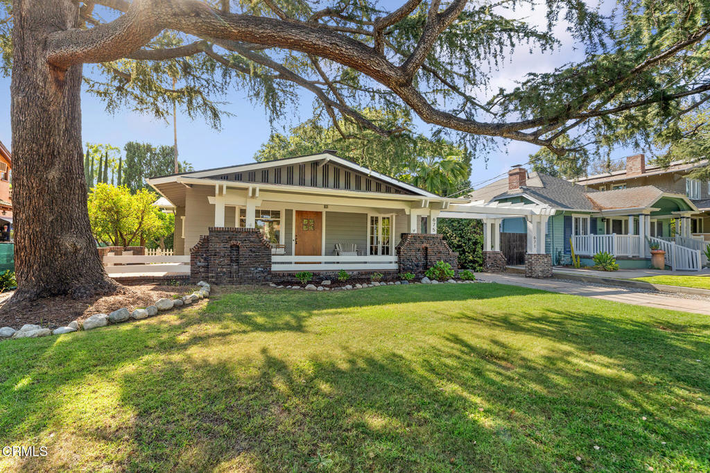 Presenting a truly exceptional and rare offering in Pasadena's highly coveted Madison Heights neighborhood: an opportunity to acquire two distinct residences on a single expansive lot. This unique property caters to a variety of lifestyles, whether you're an astute investor seeking dual income streams or a homeowner desiring a supplemental rental income while residing in one of the homes. The Front House, a graceful 1,361 SF Craftsman, immediately captivates with its welcoming wrap-around front porch and sturdy clinker brick and stone piers. Step inside to discover gleaming hardwood floors that extend throughout the home, highlighting the elegant craftsmanship of the era. The spacious layout includes three charming bedrooms and a newly renovated full bathroom showcasing modern fixtures and finishes. The heart of this home is its updated eat-in kitchen, boasting an array of stainless steel appliances that cater to culinary enthusiasts. Adjacent to the kitchen, the formal dining room is a true entertainer's delight, complete with original built-in cabinets that offer both aesthetic appeal and practical storage. This front house is truly move-in ready, having undergone significant enhancements, including a new roof, the convenience of central heating and air conditioning, new copper plumbing (2025), and fresh paint throughout the interior and exterior, ensuring a pristine living environment. Outside, the property offers both a private front and rear yard, providing idyllic spaces for entertaining guests or simply savoring your morning coffee in tranquility. The private rear yard features newly installed sod and new irrigation, in addition to a tall privacy hedge and mature fruit trees. The Back House is a charming 705 SF Cottage-style home, currently tenant-occupied, with 2 bedrooms and a pristine full bath. Adding appeal to this home is central air, hardwood floors throughout, and a lovely eat-in kitchen. The two-car garage was rebuilt; each home uses one garage space. The roofs on all structures were updated in 2023. This versatile setup presents an ideal scenario for an investor to have two income streams from two independent homes on one property. This is an extraordinary chance to own a classic in one of Pasadena's most desirable neighborhoods.