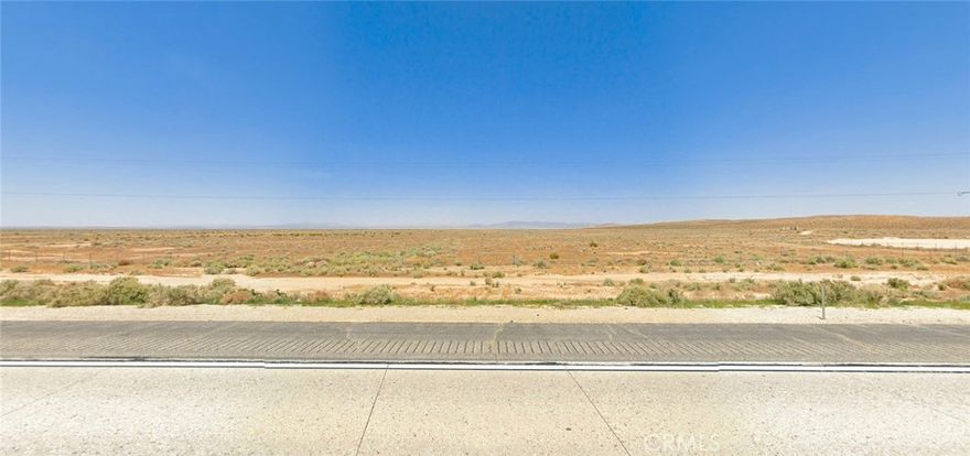 Outstanding Highway 58 frontage opportunity - 11.41 acres of level Mojave Desert land zoned single family residential with direct highway access and power lines at street for immediate development potential at $30,000. This premium Hinkley parcel offers exceptional value with coordinates 34.92404, -117.27121 providing GPS navigation to your future desert retreat, investment property, or custom home site. Located on Barstow-Bakersfield Highway 58 with recent $7.4 million infrastructure improvements ensuring reliable year-round access just 14 miles from Barstow and 120 miles northeast of Los Angeles. The flat desert scrub topography eliminates grading costs while providing excellent drainage and unlimited construction possibilities for traditional homes, manufactured housing, or recreational vehicle use. Electricity available at highway frontage significantly reduces utility connection expenses compared to remote desert properties. Water well and septic required following established San Bernardino County rural development standards. Property benefits from explosive Hinkley market growth with 24.5% annual home price appreciation and 49% faster sales than previous year creating strong investment fundamentals. This parcel is part of four adjacent lots being sold separately, offering potential for expanded development or portfolio building opportunities. Perfect for off-grid living enthusiasts, weekend escape construction, or long-term appreciation play in California's booming desert real estate corridor. Minutes from world-class Mojave National Preserve recreation including hiking trails, camping, OHV areas, plus spectacular Rainbow Basin geological formations and Kelso Dunes. San Bernardino County population projected 28% growth by 2045 supporting sustained property value increases. Ready-to-develop with highway frontage, utility access, and flexible residential zoning eliminating typical rural property obstacles. The level terrain and direct access make this ideal for immediate use while planning future construction. Don't miss this affordable entry into California desert ownership with premium highway frontage and established infrastructure. Visit coordinates 34.92404, -117.27121 today and start planning your Mojave Desert future on this exceptional Hinkley investment opportunity.