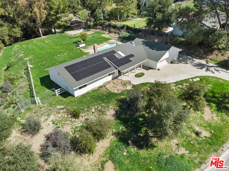 Stunning Sand Canyon Home on Nearly an Acre of Private Paradise. Welcome to this beautifully remodeled 4-bedroom, 2-bathroom home nestled in the serene beauty of Sand Canyon. Located on a massive 0.936-acre lot, this charming 2,138 square-foot residence, built in 1964, has been completely updated for modern living while preserving its timeless appeal. As you step through the front door, you're greeted by an inviting open floor plan with abundant natural light. To the right, you'll find the chef-inspired kitchen, featuring sleek brand-new quartz countertops, stunning cabinetry, and brand-new stainless steel appliances. This gorgeous space flows effortlessly into the dining and living areas, perfect for both family living and entertaining guests. Beyond the kitchen, you'll pass through the laundry room, leading to a large versatile room off the garage that offers endless possibilities whether you envision it as a media room, home office, game room, or craft space, this bonus area adapts to your lifestyle. The home also boasts four generously sized bedrooms, including a tranquil master suite, as well as two completely remodeled bathrooms. All bathrooms feature luxurious granite and quartz countertops, custom flooring, and beautifully tiled showers. Throughout the home, new laminate/vinyl flooring offers a fresh, modern look, while the ceilings have been scraped for a sleek, updated finish. Step outside into your own private oasis, where you'll find a sparkling pool perfect for relaxing and enjoying the warm California weather. The expansive backyard also features a lush grassy area. The long driveway leads directly to the barn, providing easy access and ample space for additional storage or hobbies. Key updates and features include: brand new copper plumbing, new AC. This stunning property offers the perfect blend of comfort, style, and privacy, making it an ideal place to call home. Don't miss your chance to make this Sand Canyon gem yours schedule a tour today and experience all that this incredible home has to offer! Beautifully updated by a veteran owner who has planned to make it their home- now available for a new chapter.