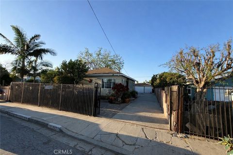 Photo of 817 W Arbutus St, Compton, CA 90220 (MLS # DW26053708)