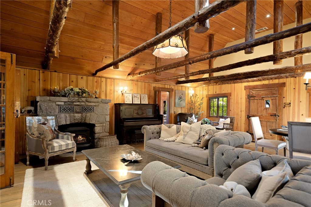 Welcome to the woodland retreat of your dreams. This level-entry vintage cabin, dating back to the early 1900s, is nestled among some of the mountain’s most breathtaking scenery. Preserved in time yet thoughtfully updated, this home blends original character and charm with modern comforts. Step inside to a cozy main living area and kitchen, all conveniently located on the entry level. Just steps away, the primary bedroom offers comfort and privacy, complete with its own patio overlooking the serene property and bordering greenbelt. A second bedroom is located on the main level with laundry attached, and above is an additional loft which can be used as a bedroom, playroom, office, and more. The landscaped grounds are a true highlight, featuring unique native plant species that bring the seasons to life : lush florals in the spring and vibrant foliage in the fall. Adding to its appeal, the property includes a spacious detached workshop and garage, providing abundant storage, parking, and versatile workspace. This one-of-a-kind retreat is more than a home—it’s a lifestyle. Don’t miss the opportunity to make it yours.